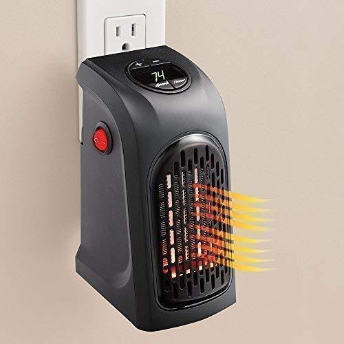 Portable heater emitting heat on a beige wall background